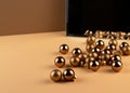 Reflection of group of christmas balls and shadow from balls in a mirror on beige surface Royalty Free Stock Photo