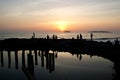 Reflection of a group of tourist during a sunset in Tanjung Aru beach