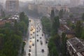 Reflection of headlights on a wet road from passing cars in heavy rain in residential areas and streets of the old city Royalty Free Stock Photo