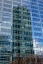 Reflection of highrise tower in the windows of another tower at La Defense busines district, paris, france