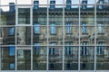 Reflection of a historic faÃÂ§ade from the Wilhelminian period in the modern, austere glass front of a high-rise building