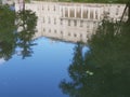 Reflection of historical mansion in town in Russia