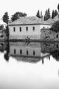 Reflection of the house in the water.