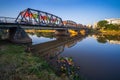 Reflection of Iron Bridge and colorful light lantern in sunrise. Loi Krathong or Yi Peng Festival in Chiang Mai, Thailand Royalty Free Stock Photo