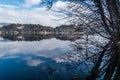 Reflection of lake Bled hills covered with trees in calm water Royalty Free Stock Photo