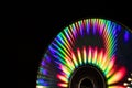 Reflection of light in a Compact Disk(CD) or Digital versatile disk(DVD).