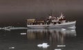 Reflection of lone boat on smooth ice filled water of Glacier Bay, Alaska Royalty Free Stock Photo