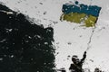 Reflection of a man with ukrainian flag