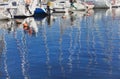 Reflection of masts in the blue water Royalty Free Stock Photo