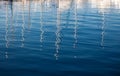 Reflection from masts on the water in the port. Royalty Free Stock Photo