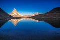 Reflection of the Matterhorn on blue lake at sunrise, Swiss Alps, Zermatt Royalty Free Stock Photo