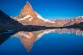 Reflection of the Matterhorn on blue lake at sunrise, Swiss Alps, Zermatt Royalty Free Stock Photo