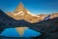 Reflection of the Matterhorn on blue lake at sunrise, Swiss Alps, Zermatt Royalty Free Stock Photo