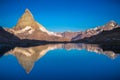 Reflection of the Matterhorn on blue lake at sunrise, Swiss Alps, Zermatt Royalty Free Stock Photo