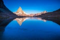 Reflection of the Matterhorn on blue lake at sunrise, Swiss Alps, Zermatt Royalty Free Stock Photo