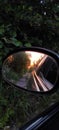 Reflection in the mirror of the car road and sunset Royalty Free Stock Photo