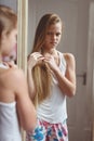 Reflection in mirror of teenage girl Royalty Free Stock Photo