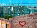 Reflection modern facade buildings and old vintage house blue Windows glass and stone of front house wall Skyscraper re Royalty Free Stock Photo