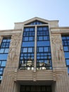 Reflection on a modern facade and old in Reims