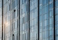 reflection of modern skyscrapers in windows of office building, during daylight Royalty Free Stock Photo