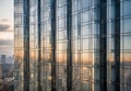reflection of modern skyscrapers in windows of office building, during daylight Royalty Free Stock Photo