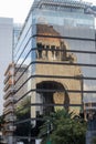 Reflection of the Monument to the Revolution on a tall building Royalty Free Stock Photo