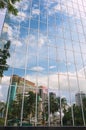 Reflection of the mosque and office buildings in the modern building windows in Kuala Lumpur, Malaysia. Royalty Free Stock Photo