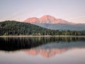 A reflection of mount shasta over a lake during sunset Royalty Free Stock Photo