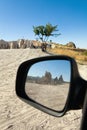 Reflection of the mountain with an ancient dwelling in the car m Royalty Free Stock Photo