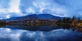 Reflection of mountains and clouds in the calm surface of the lake. Peaceful landscape. Khibiny Royalty Free Stock Photo