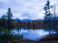 Reflection of mountains and clouds in the calm surface of the lake. Peaceful landscape. Khibiny Royalty Free Stock Photo