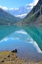 The reflection of the mountains Skazka and Krasavitsa Tale and Beautiful in a Large Shavlinskoye lake, Altai mountains, Russia Royalty Free Stock Photo