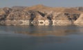 The reflection of the mountains in the Tigris River in the city of Hasankeyf in Turkey Royalty Free Stock Photo