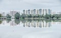 Reflection of new estate HDB housing complex on Jurong Lake, Sin