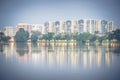 Reflection of new estate HDB housing complex on Jurong Lake, Sin