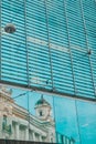 reflection of old building in glass window Royalty Free Stock Photo