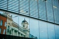 reflection of old building in glass window Royalty Free Stock Photo