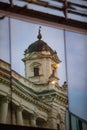 reflection of old building in glass window Royalty Free Stock Photo