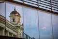 reflection of old building in glass window Royalty Free Stock Photo