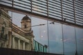 reflection of old building in glass window Royalty Free Stock Photo