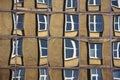 Reflection of old building out of a glasses of a modern corpaorate building (the most distorted windows may seem a bit unsharp at