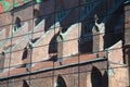 Reflection of an old, Gothic church with a multi-color roof Royalty Free Stock Photo