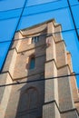 Reflection of an old, Gothic church with a multi-color roof Royalty Free Stock Photo