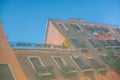 Reflection of an old Italian building in the water of the canal in Venice. Italian flags on the balcony Royalty Free Stock Photo