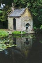 Reflection of an old water pumping house Royalty Free Stock Photo