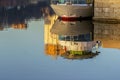 Reflection of part of ship in morning water