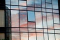 Reflection of pastel Sun set on window glass of modern corporate office building Royalty Free Stock Photo