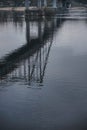 Reflection of a pedestrian bridge in the water surface of the Dnieper River in the center of the city of Kyiv Royalty Free Stock Photo