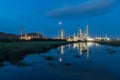 Reflection of petrochemical industry power station in evening