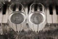 Reflection of piano keys in two wine glasses, pianoforte